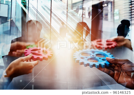 Business team connect pieces of gears. Teamwork, partnership and integration concept. double exposure. Business team connect pieces of gears. Teamwork, partnership and integration concept. double exposure. 96146325