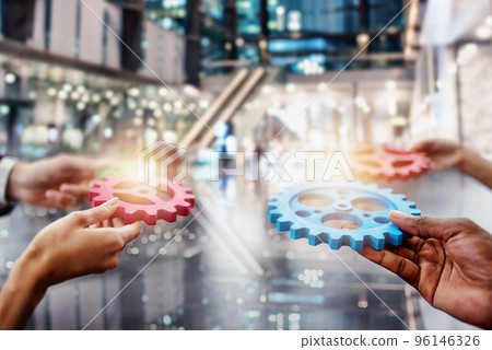 Business team connect pieces of gears. Teamwork, partnership and integration concept. double exposure. 96146326