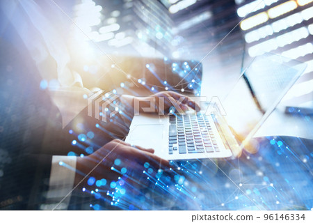 Businessman works in office with a laptop with internet effects. Concept of internet sharing and company startup 96146334