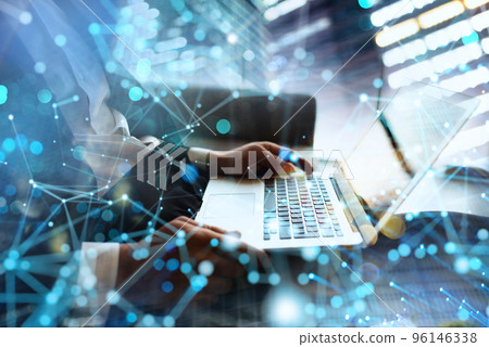 Businessman works in office with a laptop with internet effects. Concept of internet sharing and company startup 96146338