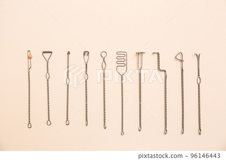 Set of logopedic probes for speech therapy on beige background, flat lay 96146443