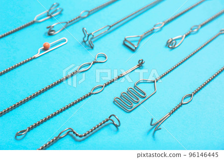 Set of logopedic probes for speech therapy on light blue background 96146445