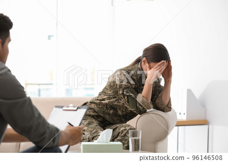Psychotherapist working with female military officer in office Psychotherapist working with female military officer in office 96146508