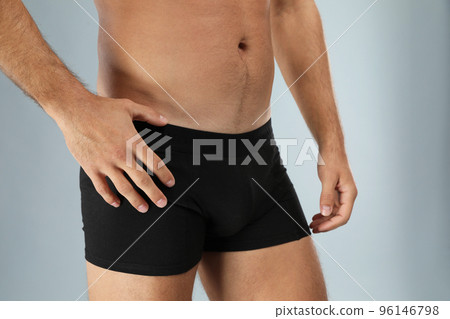 Man in black underwear on light grey background, closeup 96146798