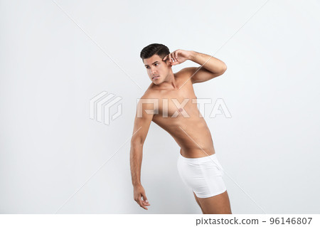 Handsome man in underwear on white background 96146807