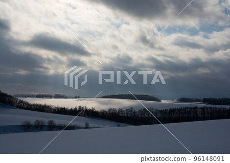 Snow hills lit by the sun 96148091