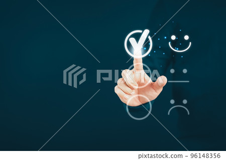 Man touching the virtual screen on the happy smiley face icon to give satisfaction in service. Rating very impressed. Customer service, testimonial satisfaction concept. 96148356