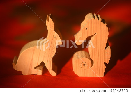 Zodiac wood carving cute figurine red background 96148733