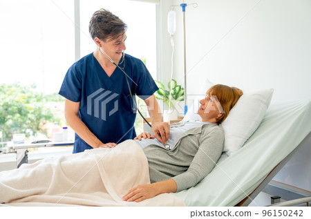 Young Caucasian doctor use stethoscope to check or diagnosis the symptom of senior patient 96150242