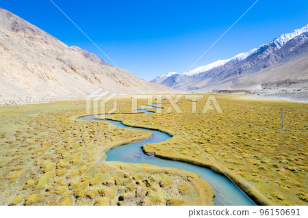 Landscape aerial view of mountains with river and green valley in Himalayas with blue sky in Nubra valley, Jammu and Kashmir, India.  96150691