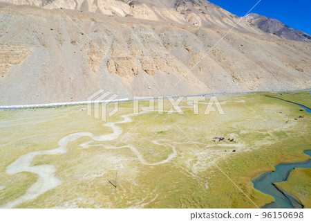 Landscape aerial view of mountains with river and green valley in Himalayas with blue sky in Nubra valley, Jammu and Kashmir, India.  96150698