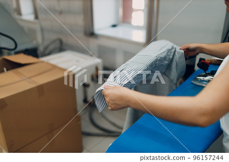 Dry cleaning ironing clothes. Clean cloth chemical process. Laundry industrial dry-cleaning 96157244