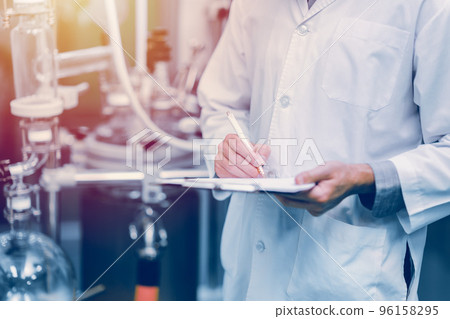 medicine science factory staff worker check quality products sterilize in autoclave tank in check list. medicine science factory staff worker check quality products sterilize in autoclave tank in check list. 96158295