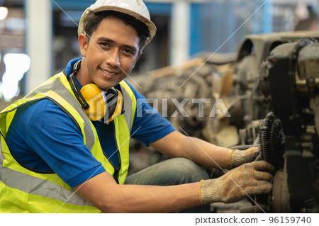portrait young male worker engineer working in heavy industry with safety happy smile looking camera portrait young male worker engineer working in heavy industry with safety happy smile looking camera 96159740