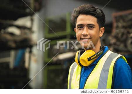 portrait young male worker engineer working in heavy industry with safety happy smile looking camera portrait young male worker engineer working in heavy industry with safety happy smile looking camera 96159741