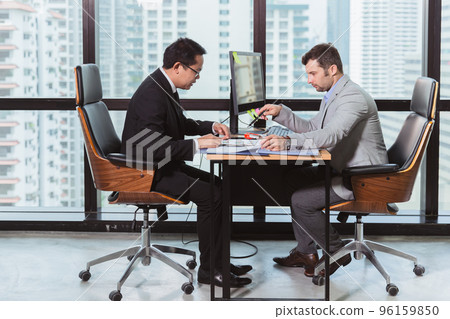 two business man join working discussion together. executive talking consult with manager at office desk. two business man join working discussion together. executive talking consult with manager at office desk. 96159850