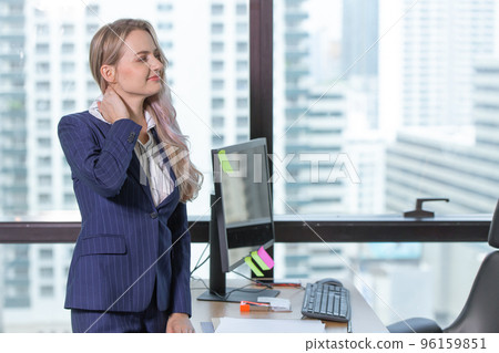 caucasion business woman suffering from office syndrome. neck muscle pain gesture. 96159851