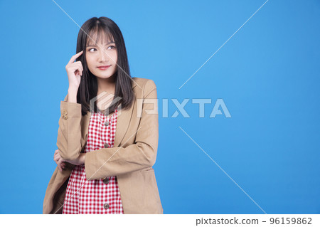 Confidence business positive Asian young woman thinking have good idea holding finger on head Confidence business positive Asian young woman thinking have good idea holding finger on head 96159862