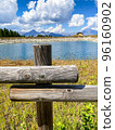 Beautiful view over a wooden fence between wooden fence posts 96160902