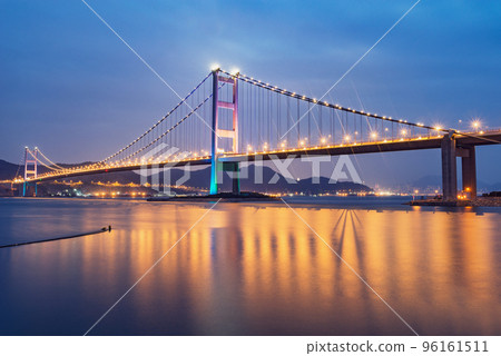 Suspension bridge to Park island at evening time. 96161511