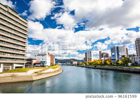 A view of both banks of the Enko River in the lower reaches of the Taisho Bridge, which spans Nishikaniya-cho and Matoba-cho. To the left of the distant bridge is Mazda Stadium A view of both banks of the Enko River in the lower reaches of the Taisho Bridge, which spans Nishikaniya-cho and Matoba-cho. To the left of the distant bridge is Mazda Stadium 96161599
