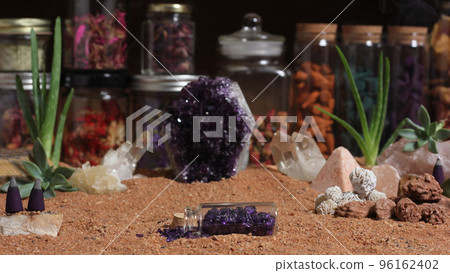 Amethyst Crystals and Chakra Stones on Australian Red Sand. Meditation Table 96162402