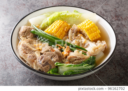 Bulalo is a Filipino stew made from beef shanks and marrow bones closeup in the bowl. Horizontal Bulalo is a Filipino stew made from beef shanks and marrow bones closeup in the bowl. Horizontal 96162702