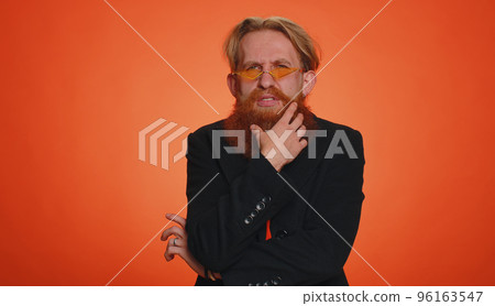 Confused man feeling embarrassed about ambiguous question, having doubts, no idea clueless uncertain Confused man feeling embarrassed about ambiguous question, having doubts, no idea clueless uncertain 96163547