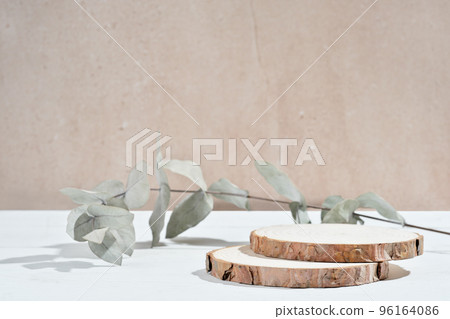 empty wooden round podium and eucalyptus branch. pedestal showcase display for product presentation. natural eco packaging promotion. 96164086