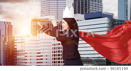 Concept of power and sucess with businesswoman superhero in big city Concept of power and sucess with businesswoman superhero in big city 96165199