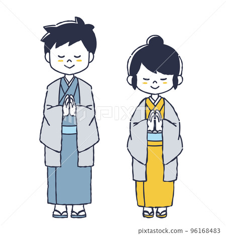 A woman and a man wearing a kimono to pray 96168483