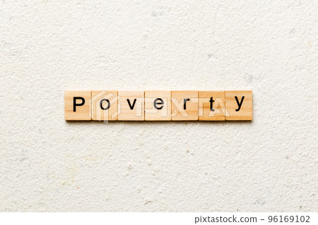 Poverty word written on wood block. Poverty text on cement table for your desing, concept Poverty word written on wood block. Poverty text on cement table for your desing, concept 96169102