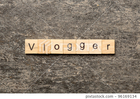 vlogger word written on wood block. vlogger text on table, concept 96169134
