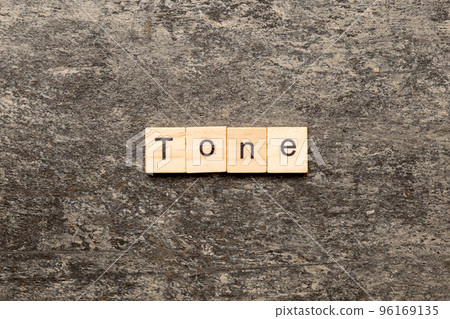 tone word written on wood block. tone text on cement table for your desing, concept 96169135