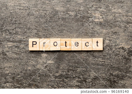 PROTECT word written on wood block. PROTECT text on cement table for your desing, concept PROTECT word written on wood block. PROTECT text on cement table for your desing, concept 96169140