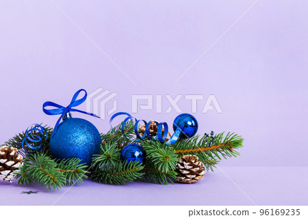 New Year Christmas tree toy, branches of a christmas tree, New Year decorations on a colored background New Year Christmas tree toy, branches of a christmas tree, New Year decorations on a colored background 96169235
