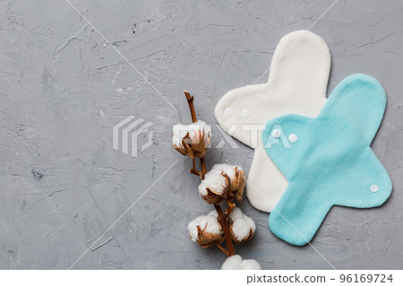 set of colorful bright reusable menstrual pads with cotton flower. zero waste woman periods concept top view with copy space set of colorful bright reusable menstrual pads with cotton flower. zero waste woman periods concept top view with copy space 96169724