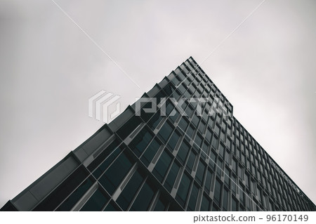 Glass building with cloudy sky angle shot Glass building with cloudy sky angle shot 96170149