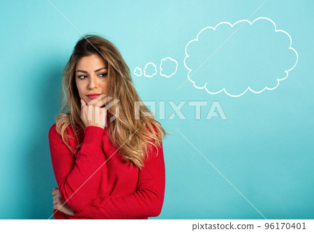 Confused woman have to choose something. Concept of options, confusion, decision. Cyan background Confused woman have to choose something. Concept of options, confusion, decision. Cyan background 96170401