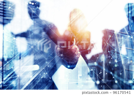 Handshaking business person in office. concept of teamwork and partnership. Double exposure Handshaking business person in office. concept of teamwork and partnership. Double exposure 96170541