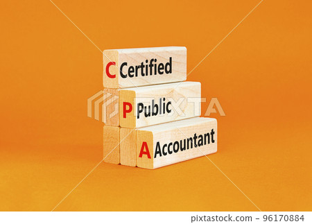 CPA certified public accountant symbol. Concept words CPA certified public accountant on wooden blocks on a beautiful orange background Business and CPA certified public accountant concept. Copy space 96170884