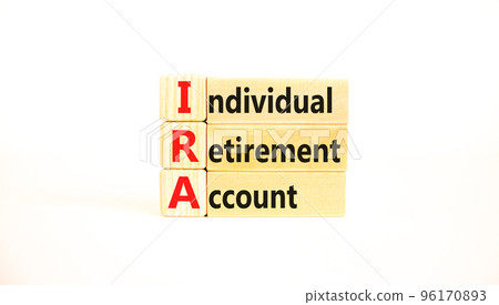 IRA individual retirement account symbol. Concept words IRA individual retirement account on wooden blocks on beautiful white background. Business IRA individual retirement account concept. Copy space IRA individual retirement account symbol. Concept words IRA individual retirement account on wooden blocks on beautiful white background. Business IRA individual retirement account concept. Copy space 96170893
