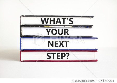 What is your next step symbol. Concept words What is your next step on books. Beautiful white table white background. What is your next step business concept. Copy space. What is your next step symbol. Concept words What is your next step on books. Beautiful white table white background. What is your next step business concept. Copy space. 96170903
