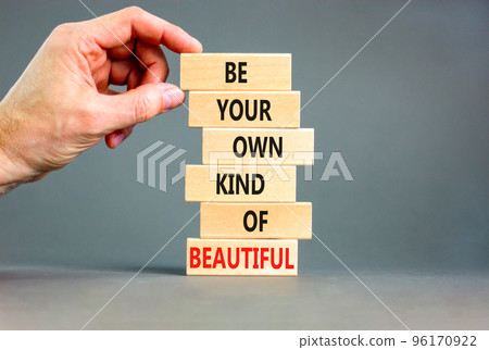 Be beautiful symbol. Concept words Be your own kind of beautiful on wooden blocks on a beautiful grey table grey background. Businessman hand. Business be your own kind of beautiful concept. Be beautiful symbol. Concept words Be your own kind of beautiful on wooden blocks on a beautiful grey table grey background. Businessman hand. Business be your own kind of beautiful concept. 96170922
