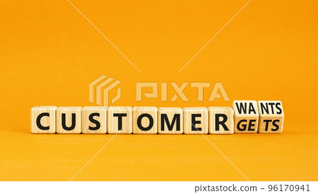 Customer wants and gets symbol. Concept words Customer wants or Customer gets on wooden cubes. Beautiful orange table orange background. Business customer wants or gets concept. Copy space. Customer wants and gets symbol. Concept words Customer wants or Customer gets on wooden cubes. Beautiful orange table orange background. Business customer wants or gets concept. Copy space. 96170941