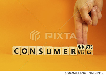 Consumer wants and needs symbol. Concept words Consumer wants or Consumer needs on wooden cubes. Businessman hand. Beautiful orange background. Business Consumer wants or needs concept. Copy space. Consumer wants and needs symbol. Concept words Consumer wants or Consumer needs on wooden cubes. Businessman hand. Beautiful orange background. Business Consumer wants or needs concept. Copy space. 96170942