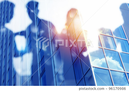 Businessmen that work together in office. Concept of teamwork and partnership. double exposure 96170986