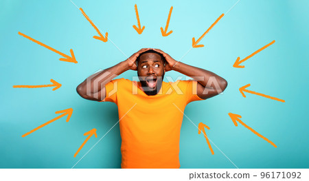 Feared, confused and shocked expression of a boy followed by arrows. cyan colored background 96171092