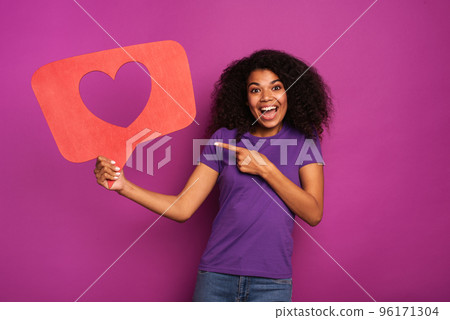 Woman is happy because receives hearts on social network 96171304