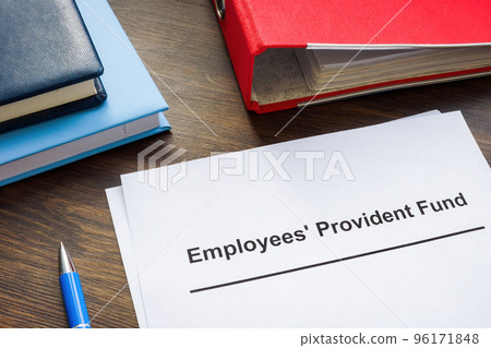Documents about Employees Provident Fund and red folder. Documents about Employees Provident Fund and red folder. 96171848